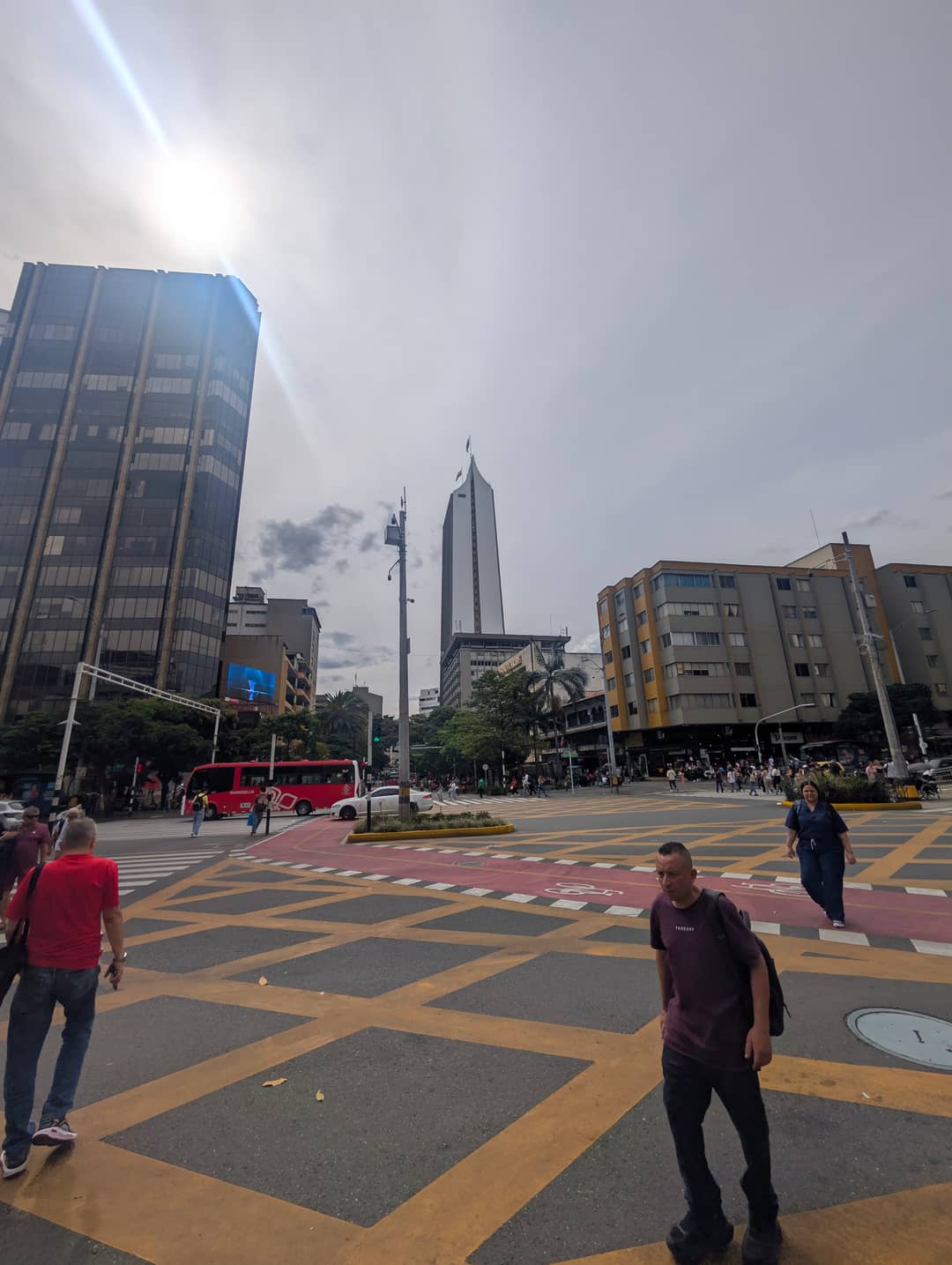 Pedestrians on a chequered crossing.