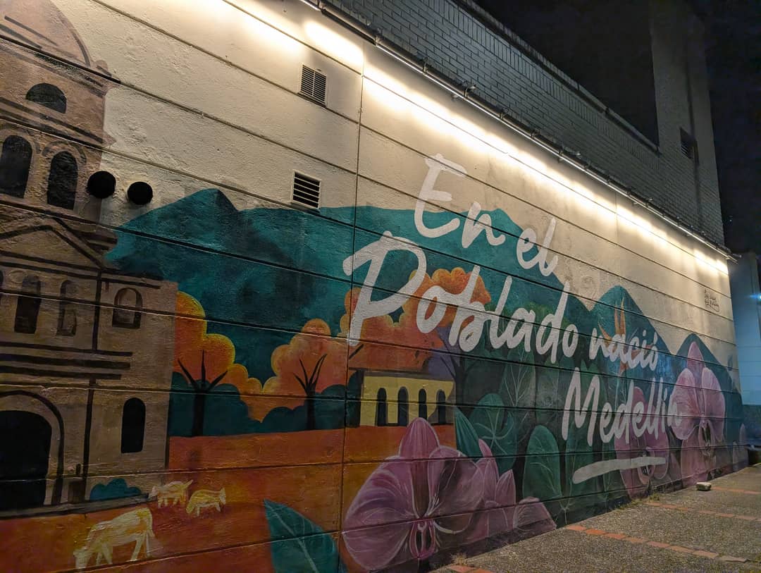 A mural on a wall: Medellín was born in El Poblado. It is literally true.