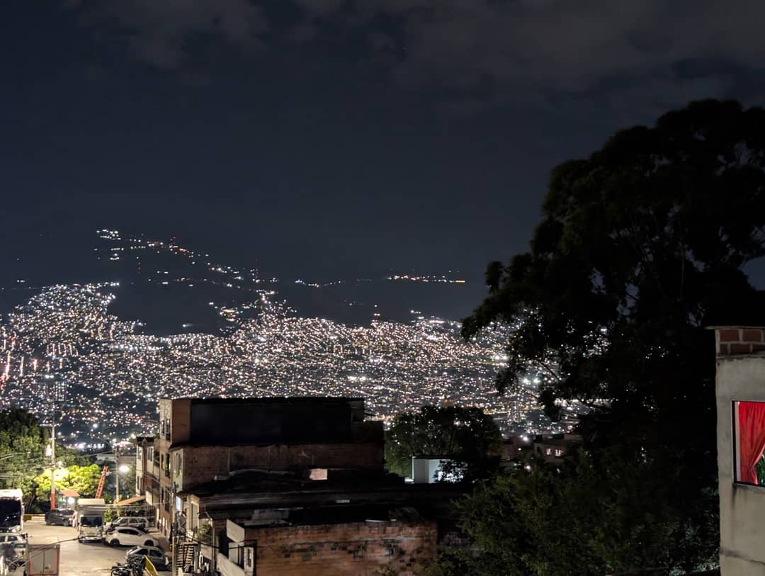 Medellín after dark. The lights are not on a plane, they are stacked.