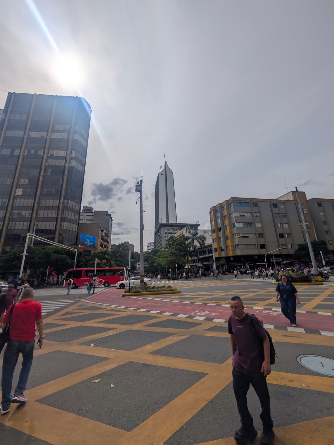 Pedestrians on a chequered crossing.