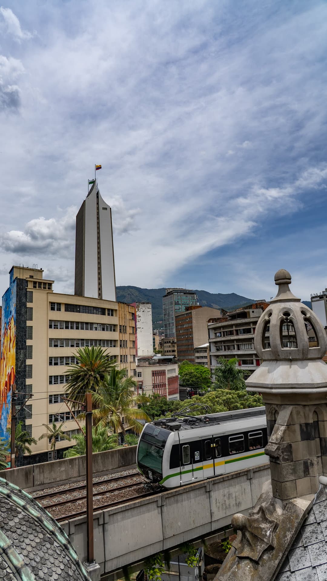 A line A train passes the domes of the Palacio de la Cultura. The metro has run since 1995 and is still the only one in Colombia.