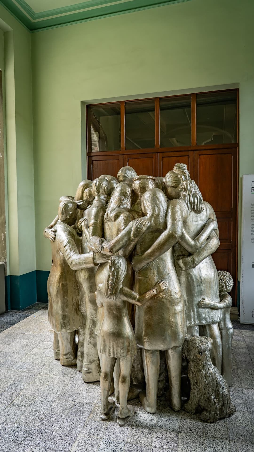 A group of figures by the door.