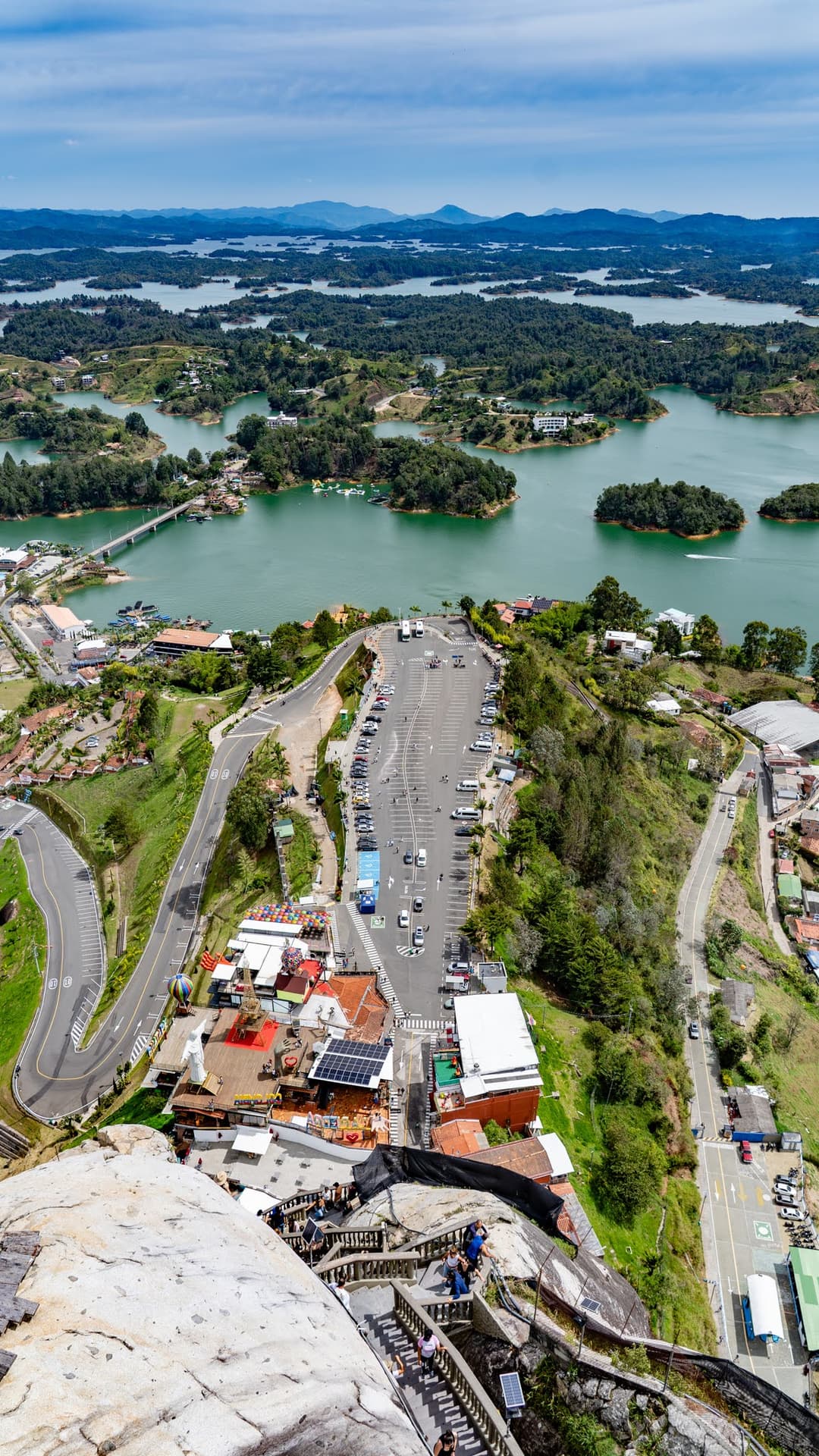 Looking down at the car park and the stalls below the rock.